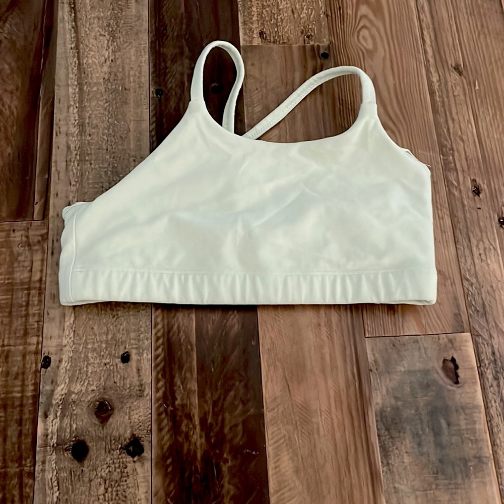 This is a yellow crop top from Athleta Girl. Size L/12.